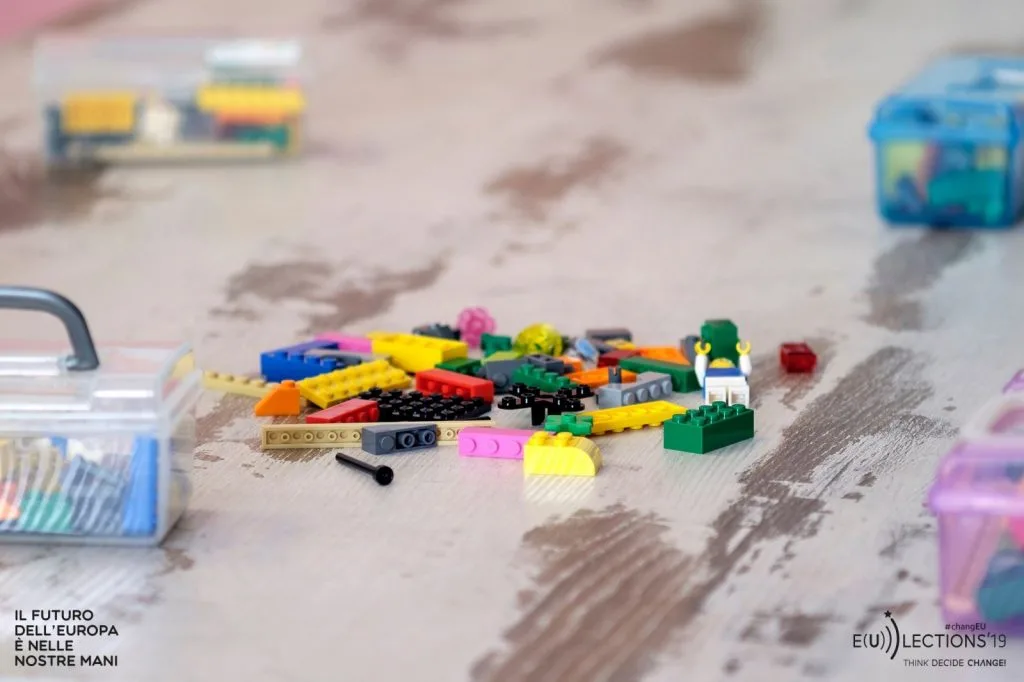 Lego pieces spread over the table.